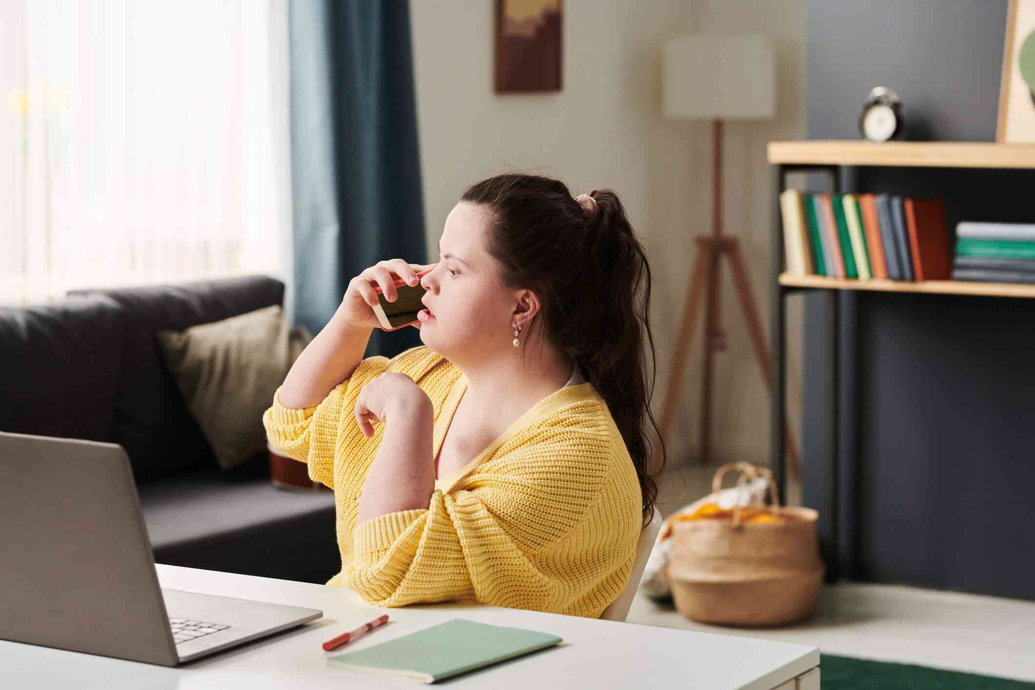 2801031d0f1eb71b10430972f5224f19-woman-yellow-sweater-speaks-on-phone_l